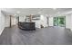 Spacious finished basement with stylish bar area, sliding doors and sleek gray flooring at 1582 Pine Cir, Austell, GA 30168