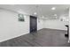 Spacious finished basement features durable flooring and ample space for a variety of uses at 1582 Pine Cir, Austell, GA 30168