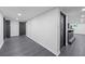 The finished basement features newly installed dark wood-look flooring and a dry bar at 1582 Pine Cir, Austell, GA 30168