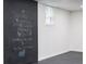 Finished basement chalkboard wall provides a fun, personalized touch, adding character and charm to the home at 1582 Pine Cir, Austell, GA 30168