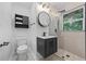 Modern bathroom features sleek black fixtures, a glass shower, and stylish tile accents at 1582 Pine Cir, Austell, GA 30168