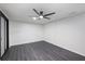 Bedroom featuring a ceiling fan and hardwood floors at 1582 Pine Cir, Austell, GA 30168