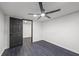 Bedroom featuring a ceiling fan and hardwood floors at 1582 Pine Cir, Austell, GA 30168