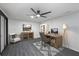 Bedroom featuring a ceiling fan, hardwood floors and an office setup at 1582 Pine Cir, Austell, GA 30168