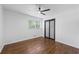 Inviting bedroom with wood floors, a ceiling fan, and plenty of natural light at 1582 Pine Cir, Austell, GA 30168