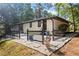 Charming painted brick ranch home with a landscaped yard, patio area, and a welcoming entrance at 1582 Pine Cir, Austell, GA 30168