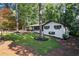 Beautiful single Gathering home featuring a large yard and black trim windows at 1582 Pine Cir, Austell, GA 30168