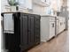 Well-equipped kitchen island with butcher block top and extra cabinet space, beside modern white cabinetry at 1582 Pine Cir, Austell, GA 30168