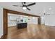 Open concept kitchen featuring island with breakfast bar, stainless appliances and updated white cabinetry at 1582 Pine Cir, Austell, GA 30168
