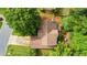 Aerial shot of a well-maintained house with a brown roof surrounded by lush trees and green lawns at 1593 Poplarwood Lane Northwest Ln, Lawrenceville, GA 30043