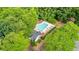 Aerial view of the community pool surrounded by lush greenery and shade trees at 1593 Poplarwood Lane Northwest Ln, Lawrenceville, GA 30043