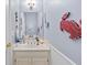 Charming bathroom features a white vanity and decorative crab wall art at 1593 Poplarwood Lane Northwest Ln, Lawrenceville, GA 30043