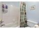 Functional bathroom with a shower-tub combination and patterned shower curtain at 1593 Poplarwood Lane Northwest Ln, Lawrenceville, GA 30043