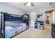 Comfortable bedroom with a bunk bed, carpet and natural lighting at 1593 Poplarwood Lane Northwest Ln, Lawrenceville, GA 30043
