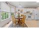 Bright breakfast nook featuring white appliances, a round table, and natural light at 1593 Poplarwood Lane Northwest Ln, Lawrenceville, GA 30043