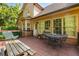 Outdoor deck with comfortable seating and a view of the house's exterior, blending indoor/outdoor living at 1593 Poplarwood Lane Northwest Ln, Lawrenceville, GA 30043