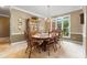 Elegant dining room featuring a large wooden table, ample seating, and natural lighting at 1593 Poplarwood Lane Northwest Ln, Lawrenceville, GA 30043