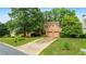 Beautiful home with a two-car garage, lush landscaping, and an expansive driveway at 1593 Poplarwood Lane Northwest Ln, Lawrenceville, GA 30043