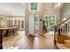 Inviting foyer featuring wood flooring, a staircase, and an open view to the dining area at 1593 Poplarwood Lane Northwest Ln, Lawrenceville, GA 30043