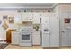 Well-lit kitchen with white cabinets, modern appliances, and a functional layout at 1593 Poplarwood Lane Northwest Ln, Lawrenceville, GA 30043
