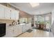 Bright kitchen with white cabinets, breakfast nook, and ample natural light at 1593 Poplarwood Lane Northwest Ln, Lawrenceville, GA 30043
