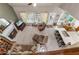 An aerial view of a sun-filled living room and kitchen featuring a fireplace and comfortable seating at 1593 Poplarwood Lane Northwest Ln, Lawrenceville, GA 30043
