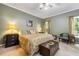 Spacious main bedroom with a ceiling fan and a serene color palette at 1593 Poplarwood Lane Northwest Ln, Lawrenceville, GA 30043