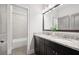Bathroom features a double sink vanity with granite countertops and a shower-tub combo at 1596 Fearn Ne Cir, Brookhaven, GA 30319