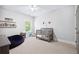 Bright Bedroom with neutral carpet, a window, and a gray crib at 1596 Fearn Ne Cir, Brookhaven, GA 30319