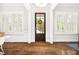 Bright foyer featuring hardwood floors, natural light, and elegant trim at 1596 Fearn Ne Cir, Brookhaven, GA 30319