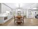 Eat-in kitchen with stainless steel appliances, white cabinetry, and an adjacent dining area at 1596 Fearn Ne Cir, Brookhaven, GA 30319