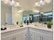 Elegant bathroom with double vanities, stylish fixtures, and a glass-enclosed shower offers a luxurious and functional space at 2587 Ocean Walk Nw Dr, Atlanta, GA 30318