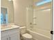 Bathroom featuring a tub and shower, with modern fixtures and natural light at 2587 Ocean Walk Nw Dr, Atlanta, GA 30318