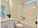 Clean bathroom featuring a combined bathtub and shower, a single vanity, and neutral colors offering a functional design at 2587 Ocean Walk Nw Dr, Atlanta, GA 30318