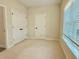 Spacious bedroom with neutral carpet, natural light, and a walk-in closet at 2587 Ocean Walk Nw Dr, Atlanta, GA 30318
