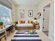 Cozy bedroom with a playful rug, comfortable daybed, and bright decor creates a fun and inviting space at 2587 Ocean Walk Nw Dr, Atlanta, GA 30318