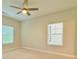 Bedroom featuring a ceiling fan and two windows offering natural light and ventilation at 2587 Ocean Walk Nw Dr, Atlanta, GA 30318
