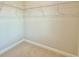 Walk-in closet with carpet and wire shelving provides ample storage space at 2587 Ocean Walk Nw Dr, Atlanta, GA 30318