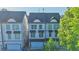New townhomes with inviting exteriors, garages, and manicured green spaces at 2587 Ocean Walk Nw Dr, Atlanta, GA 30318