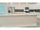 Large kitchen island with granite counters, and stainless steel dishwasher is great for entertaining at 2587 Ocean Walk Nw Dr, Atlanta, GA 30318