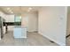 View of open floor plan between Kitchen and Living Room with an island and stainless steel appliances at 2587 Ocean Walk Nw Dr, Atlanta, GA 30318