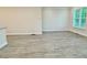 Bright living room featuring hardwood floors, recessed lighting, and a large window for natural light at 2587 Ocean Walk Nw Dr, Atlanta, GA 30318