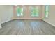 Bright living room featuring hardwood floors, recessed lighting, and large windows for natural light at 2587 Ocean Walk Nw Dr, Atlanta, GA 30318