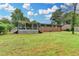 Large backyard with brick home and sunroom, perfect for outdoor activities at 3799 Sweetbriar Cir, Lithia Springs, GA 30122