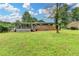 Large backyard with brick house and sunroom at 3799 Sweetbriar Cir, Lithia Springs, GA 30122