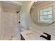 Bright bathroom features a shower-tub combo, modern vanity and fixtures, and neutral decor at 3799 Sweetbriar Cir, Lithia Springs, GA 30122