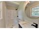 Bright bathroom features a shower-tub combo, modern vanity and fixtures, and neutral decor at 3799 Sweetbriar Cir, Lithia Springs, GA 30122