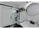 Modern bathroom with glass-enclosed shower and round mirror at 3799 Sweetbriar Cir, Lithia Springs, GA 30122