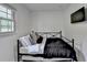 Bright bedroom with daybed, window, and wall-mounted television at 3799 Sweetbriar Cir, Lithia Springs, GA 30122