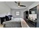 Bright bedroom featuring black furnishings, wall-mounted tv, and natural light at 3799 Sweetbriar Cir, Lithia Springs, GA 30122